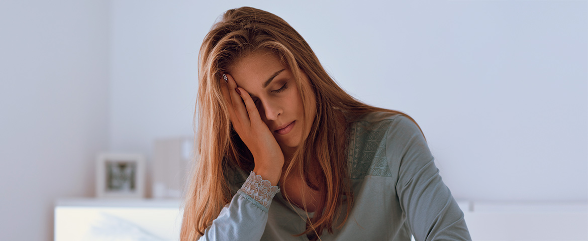 woman resting her head on her hand