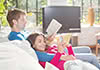 boy and girl reading on couch