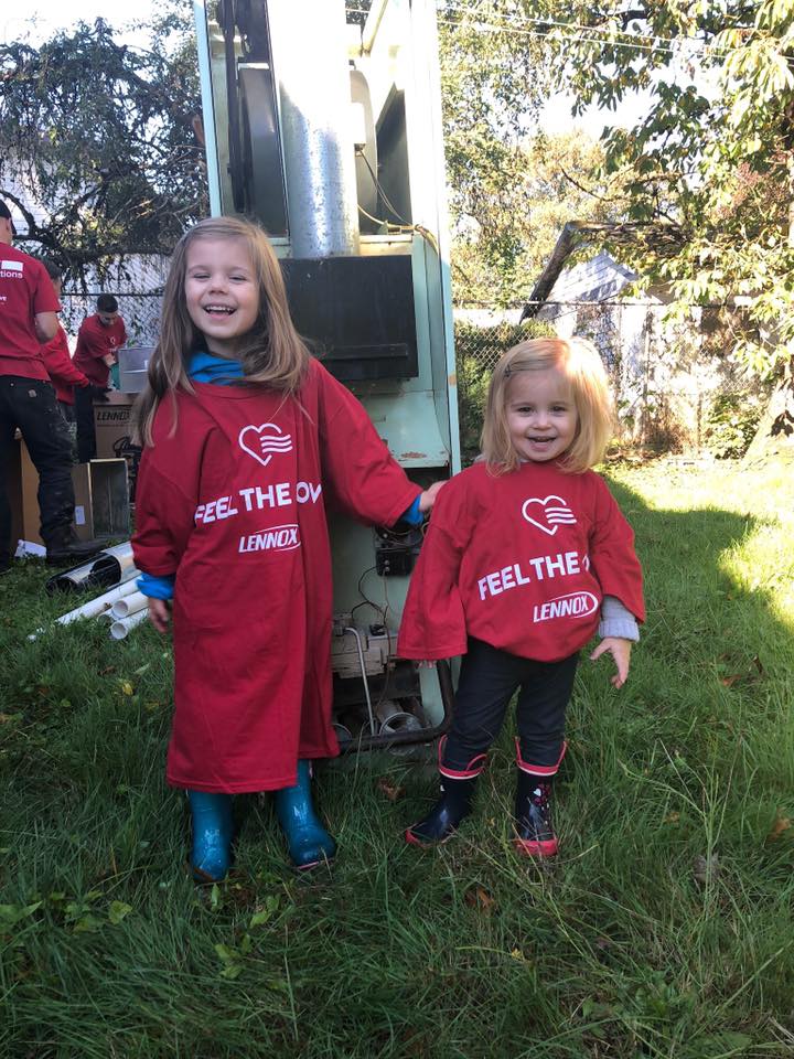 Two small girls in "Feel the Love" T-shirts